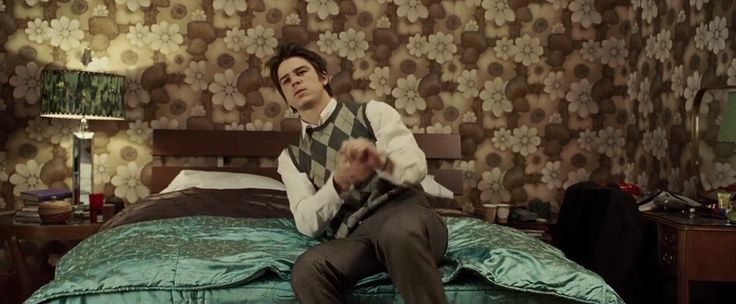 From movie Lucky Number Slevin. Josh Hartnett sitting on bed.