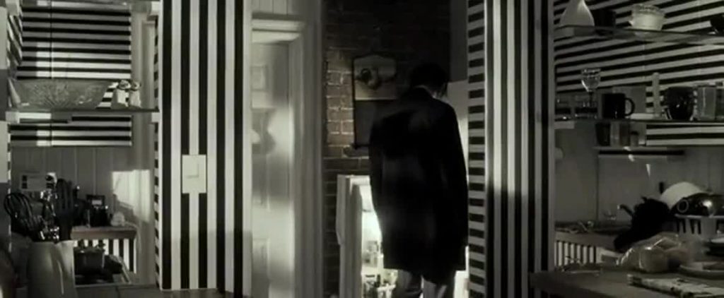 From movie Lucky Number Slevin. Kitchen with stripped wallpaper.